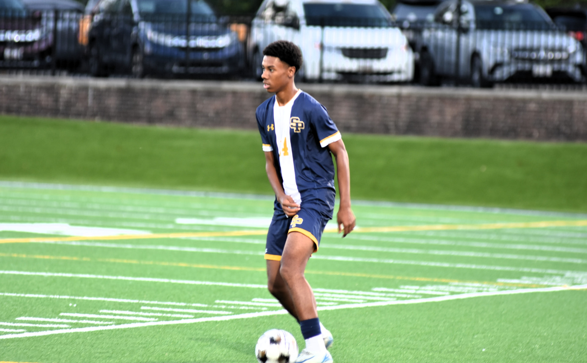 St. Paul's player controls the ball on the turf