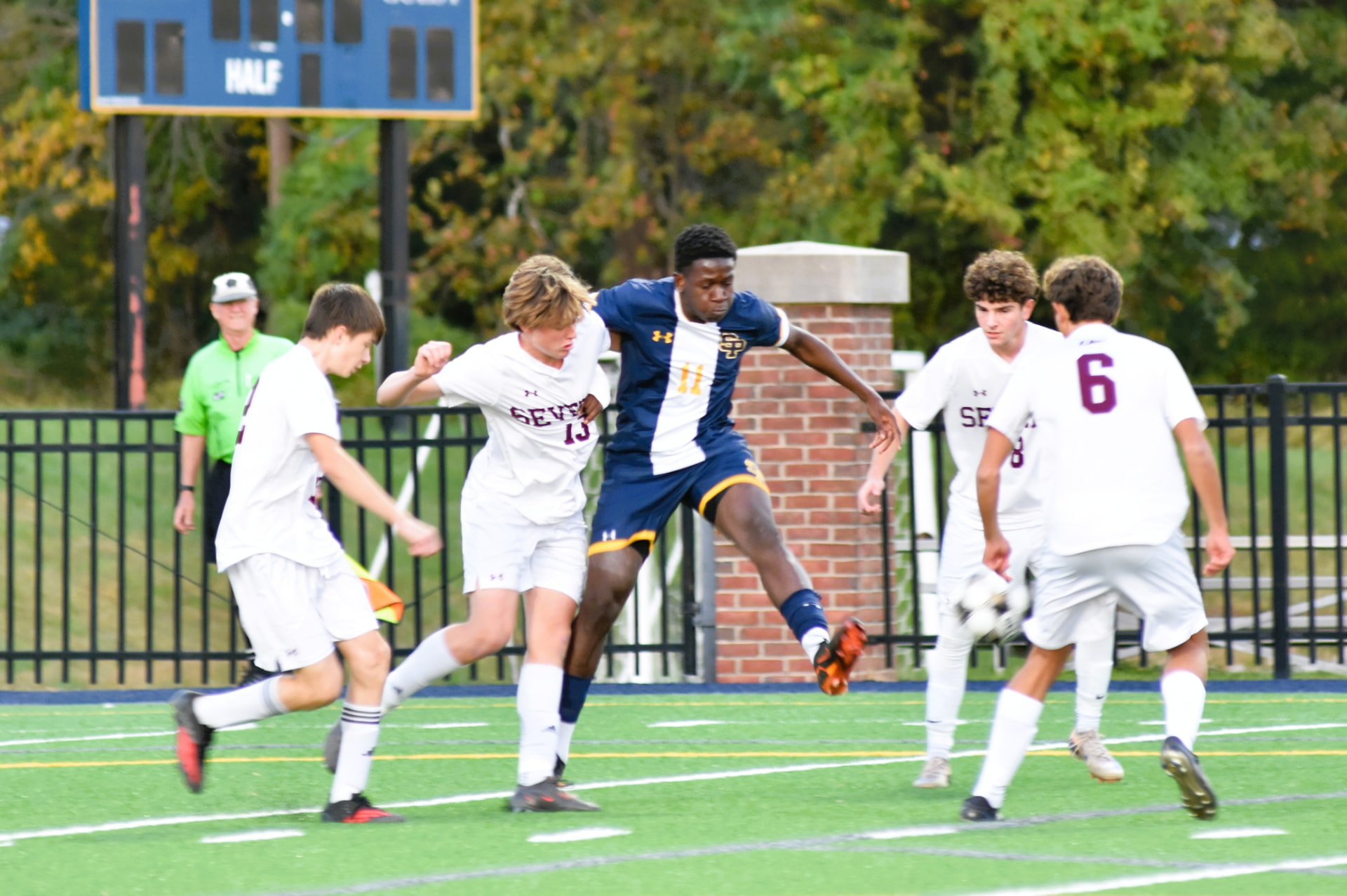 SP player leaps to challenge Severn for the ball