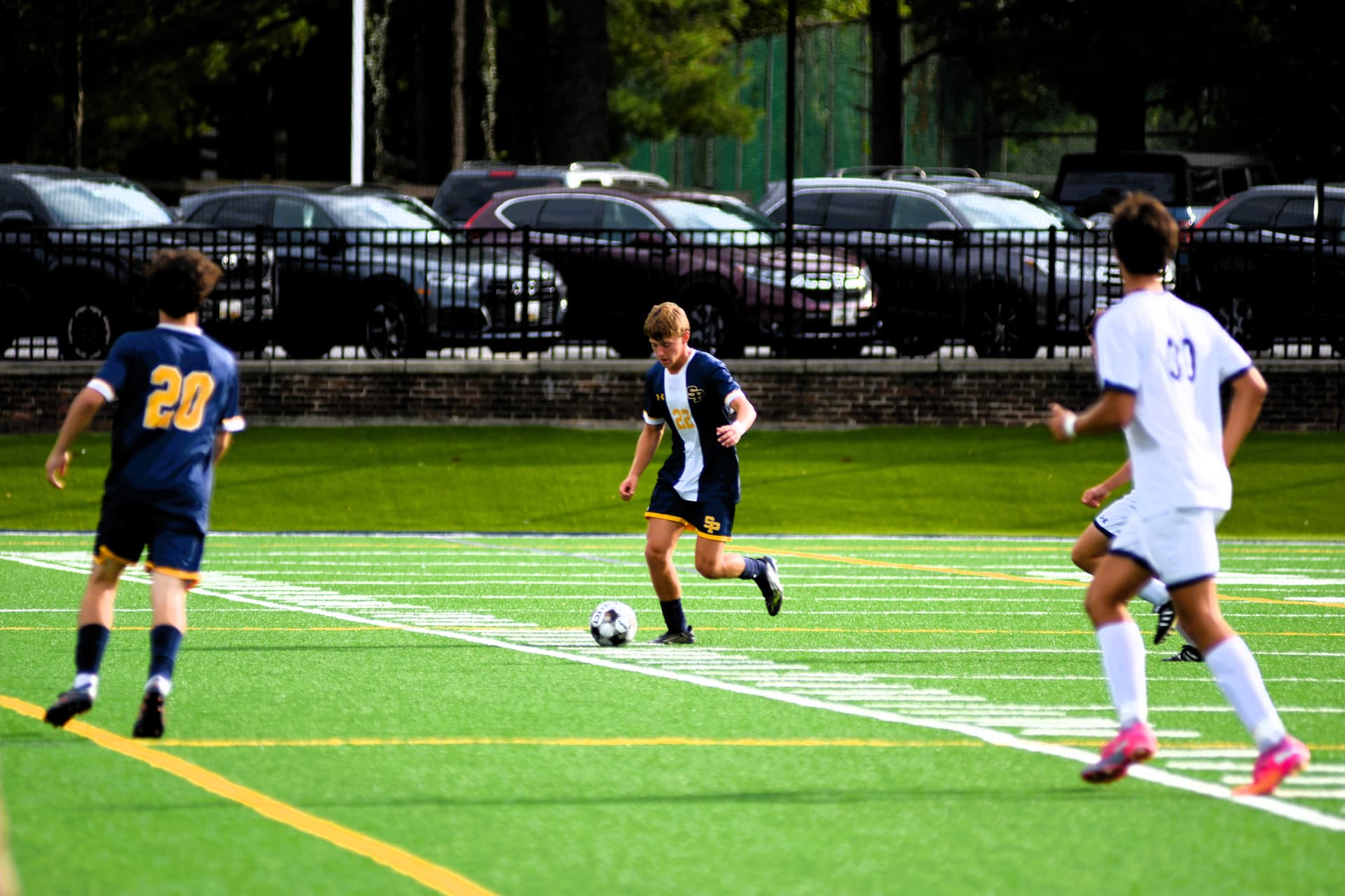 St. Paul's number 22 carries the ball upfield