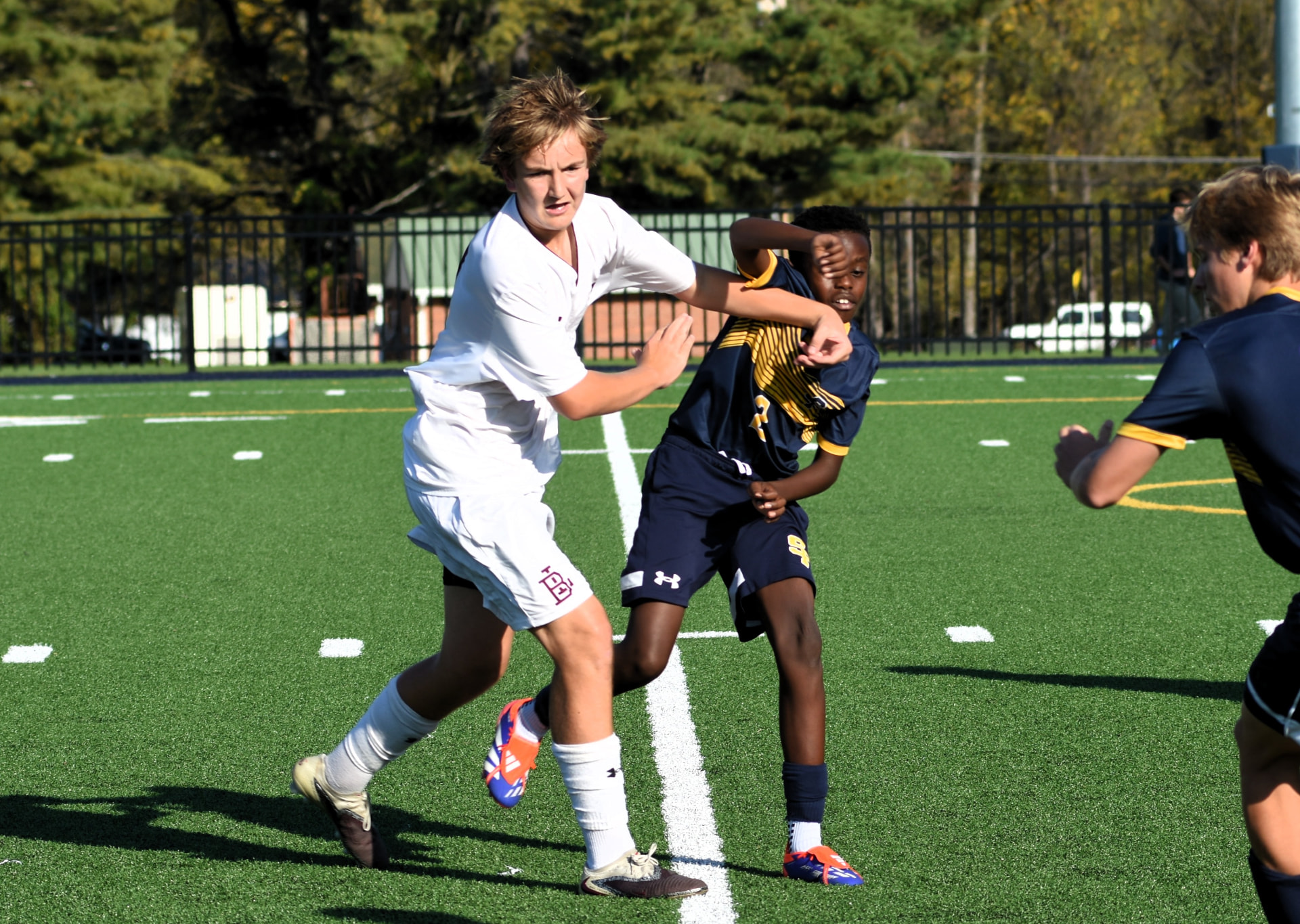 A Crusader battles a BL player for position
