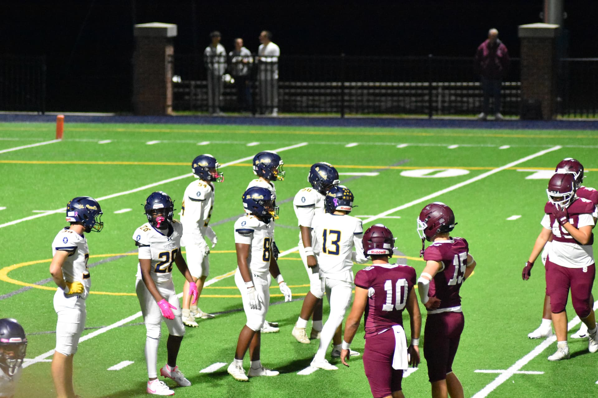 St. Paul's offense lines up against Severn under the lights