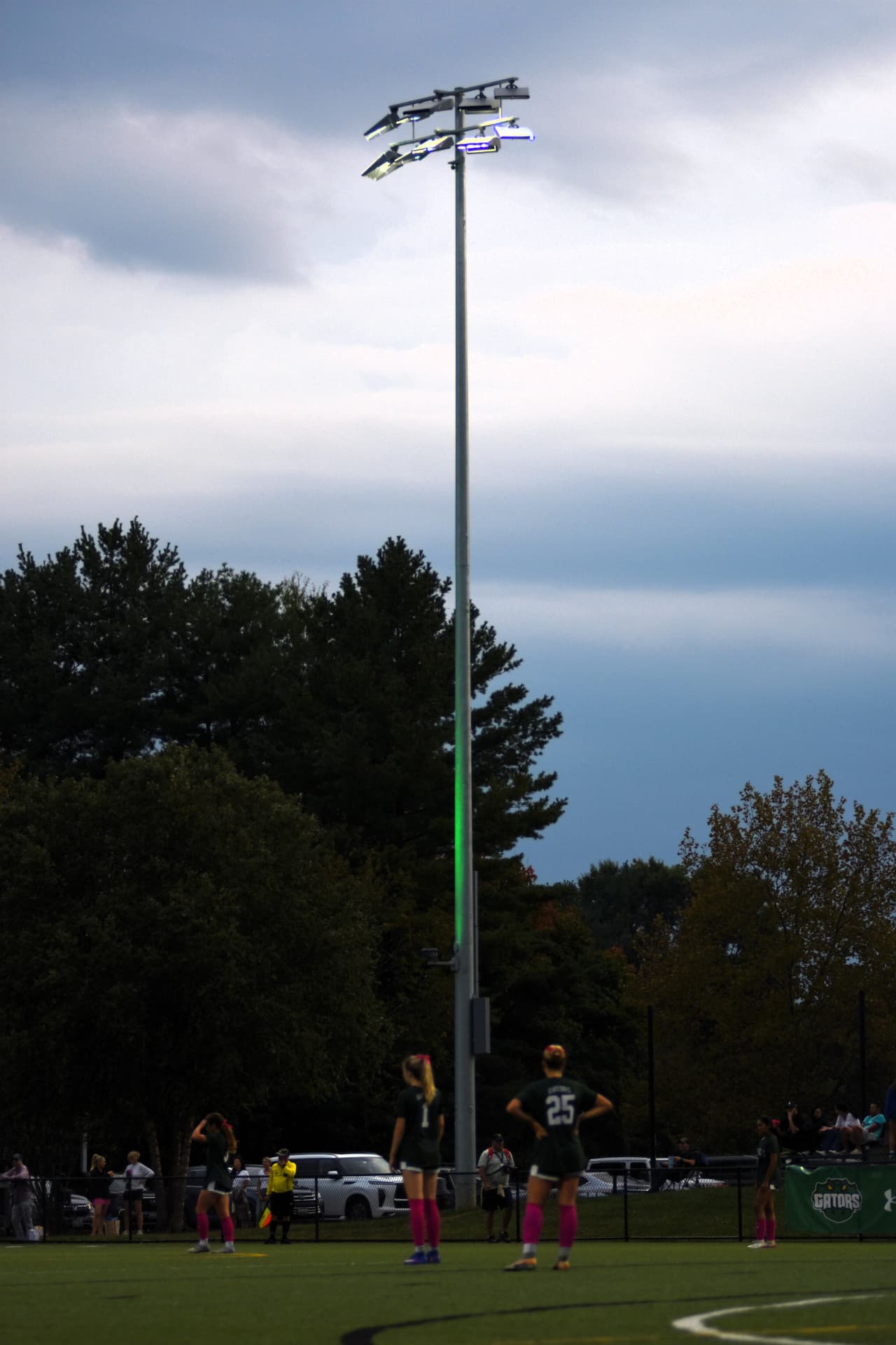 The stadium lights glow over the field as the Gators wait for play