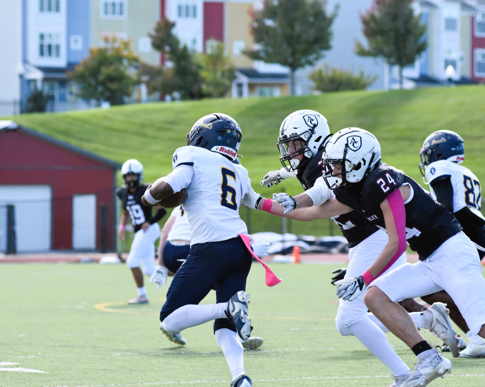 Crusaders number 6 evades Curley defenders reaching for a tackle