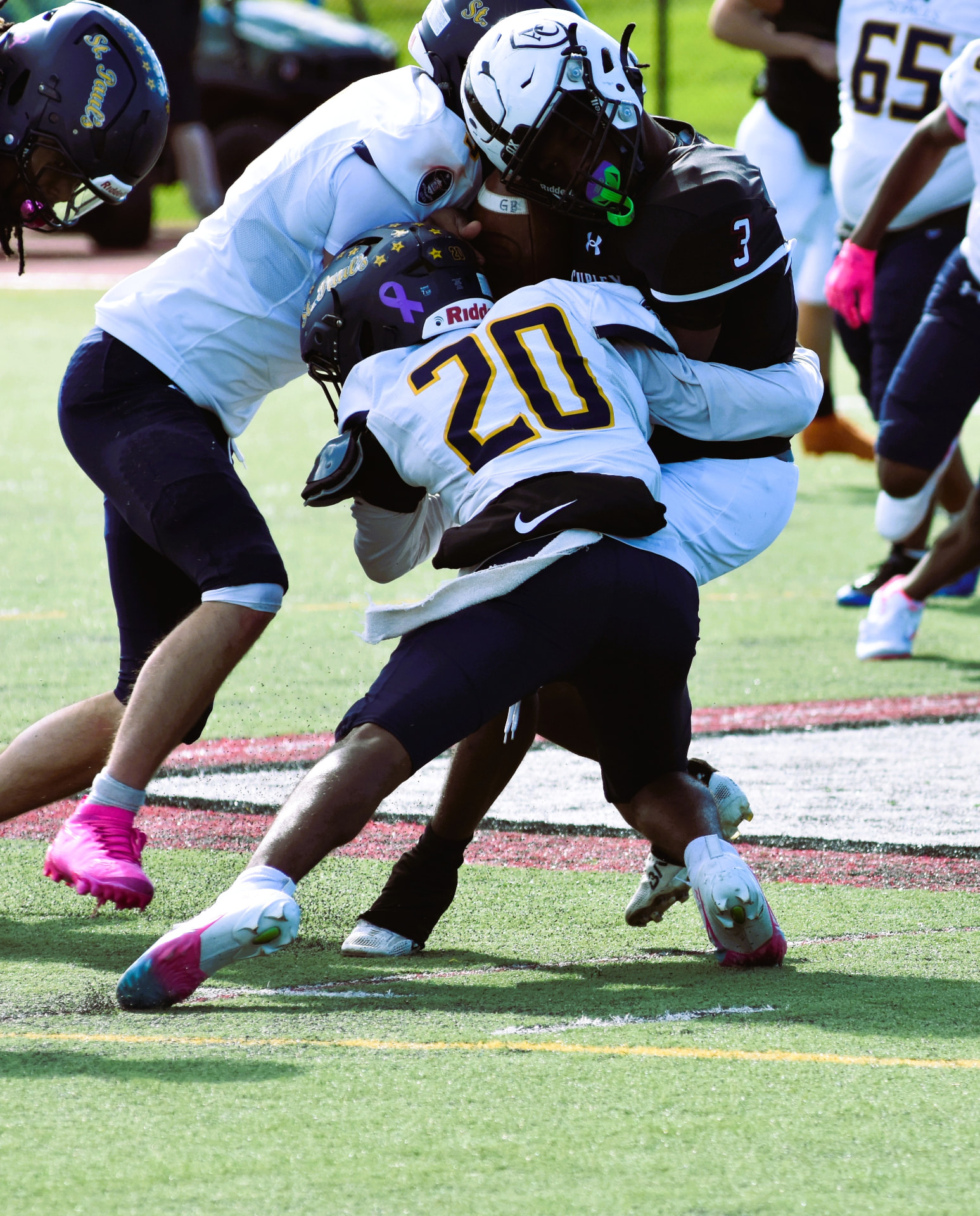 Crusaders number 20 and a teammate tackle Curley's ball carrier