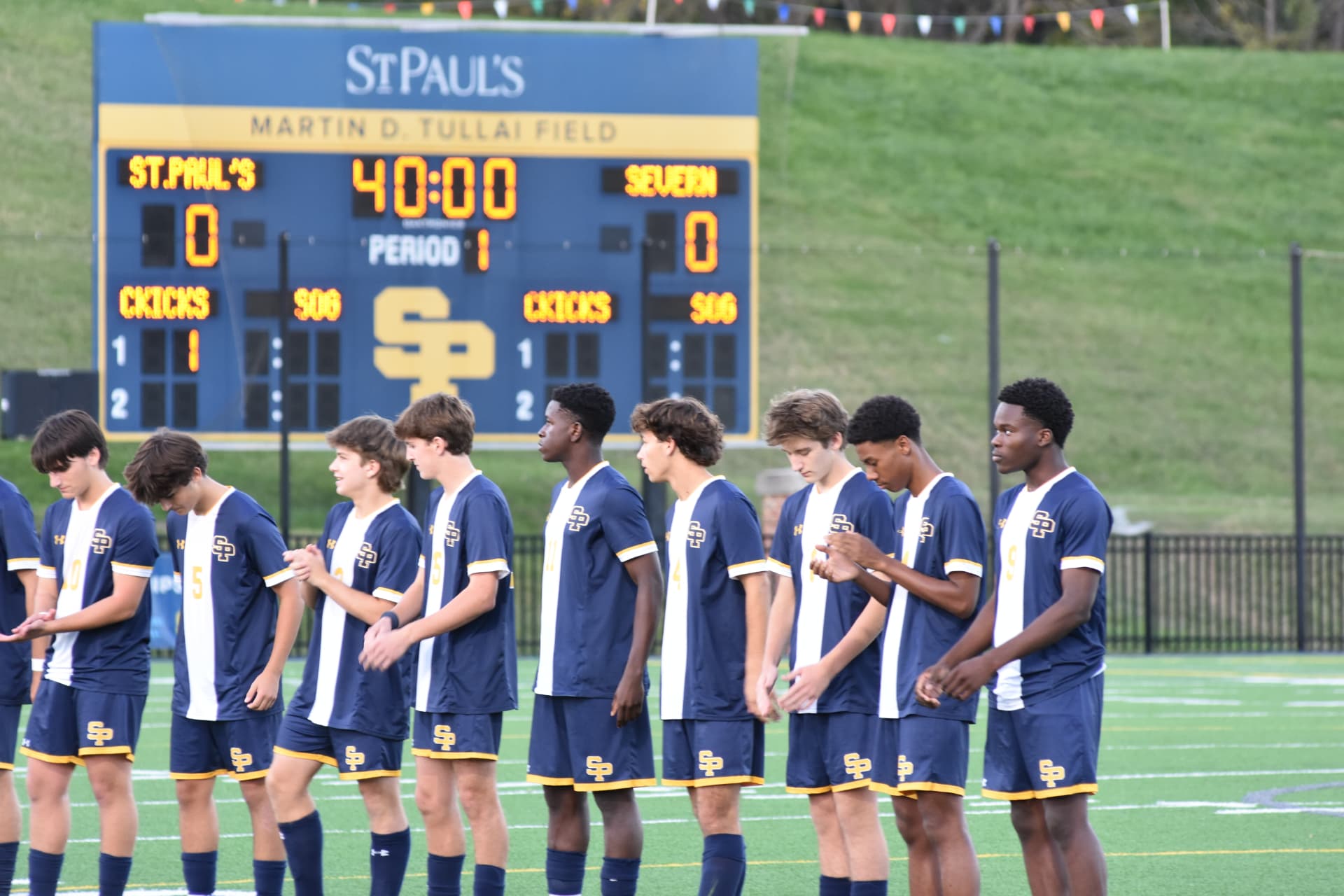 SP players line up in front of the Severn scoreboard