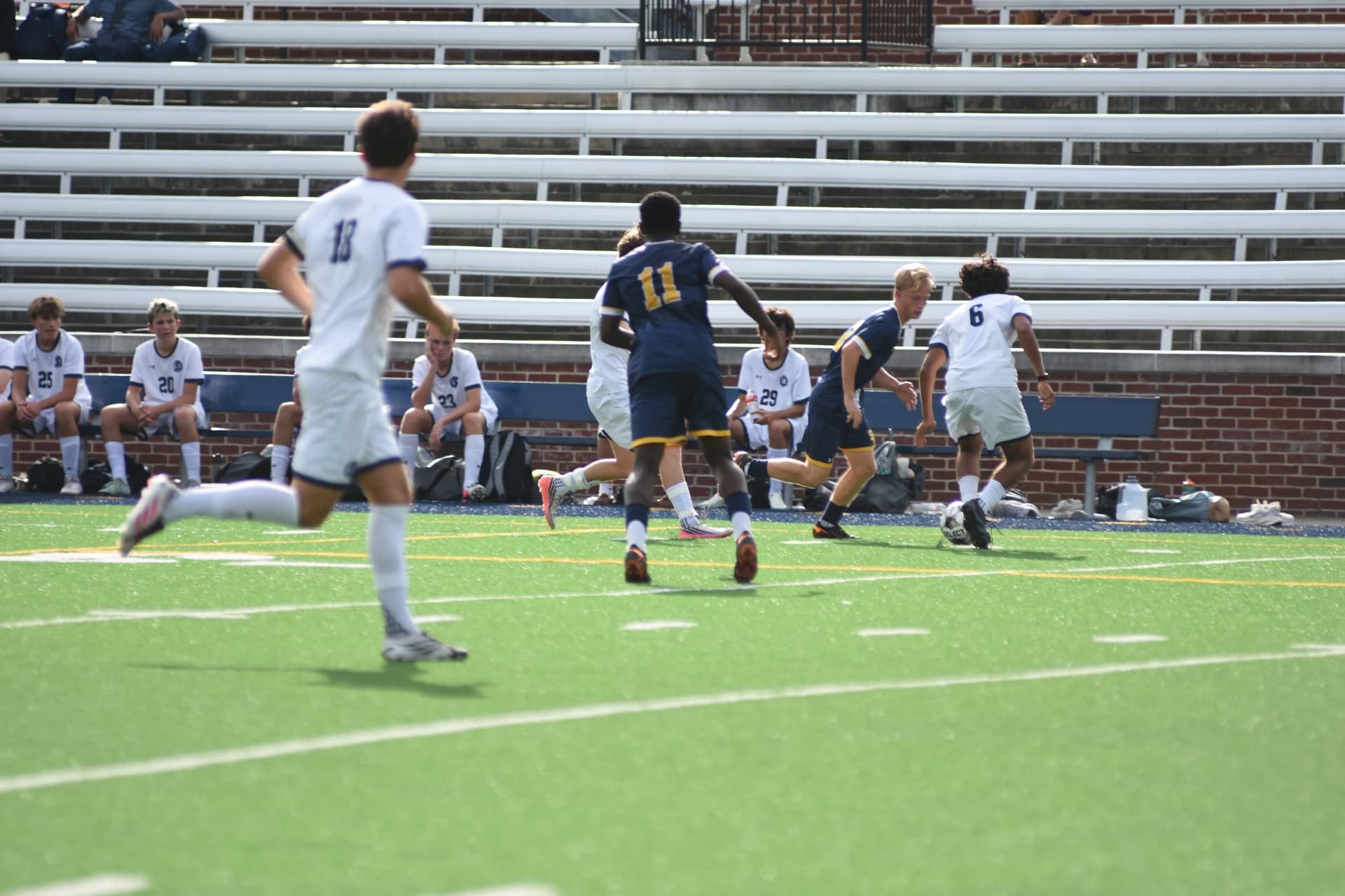 St. Paul's players press as StP&P's bench looks on