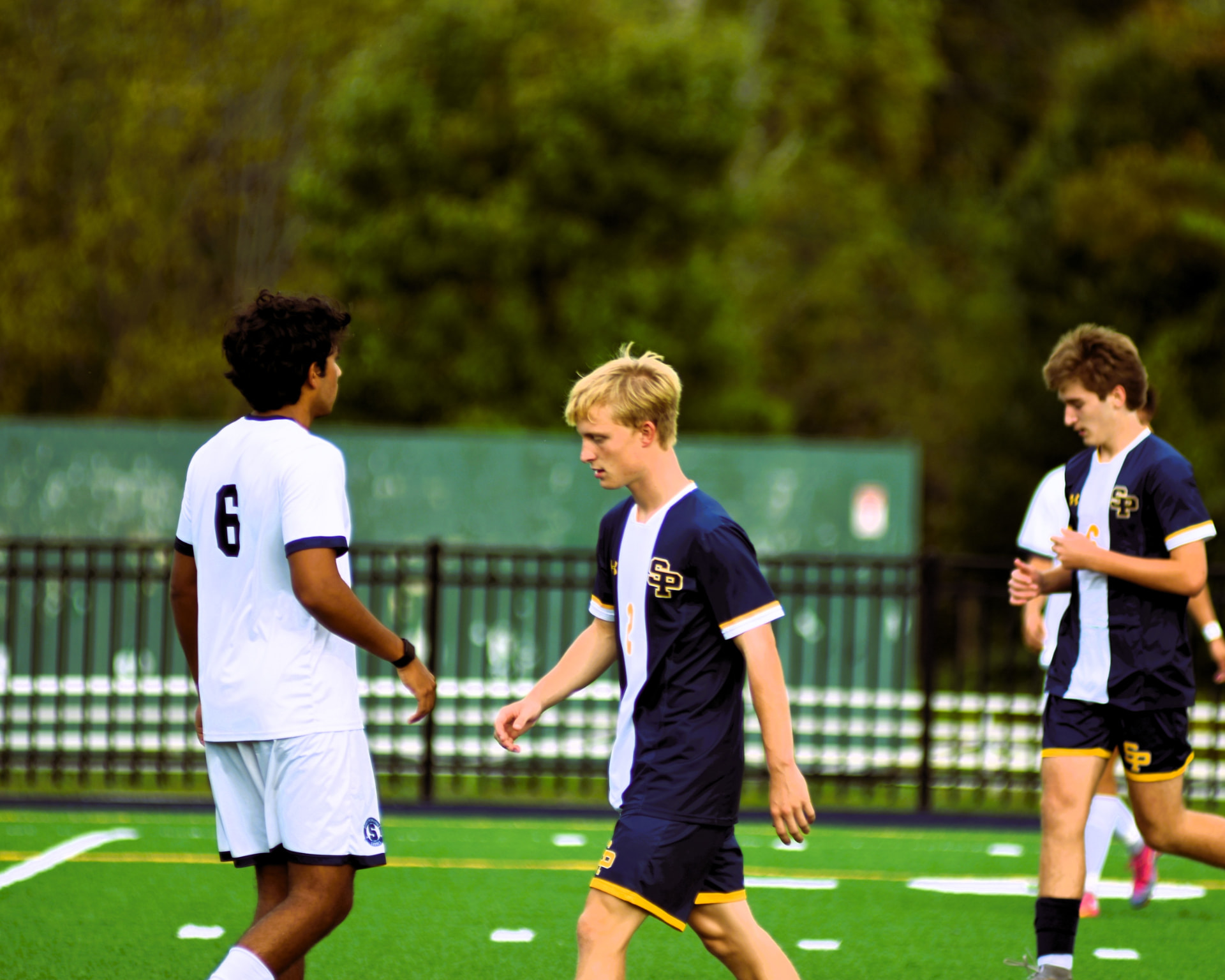 St. Paul's players walk back into position