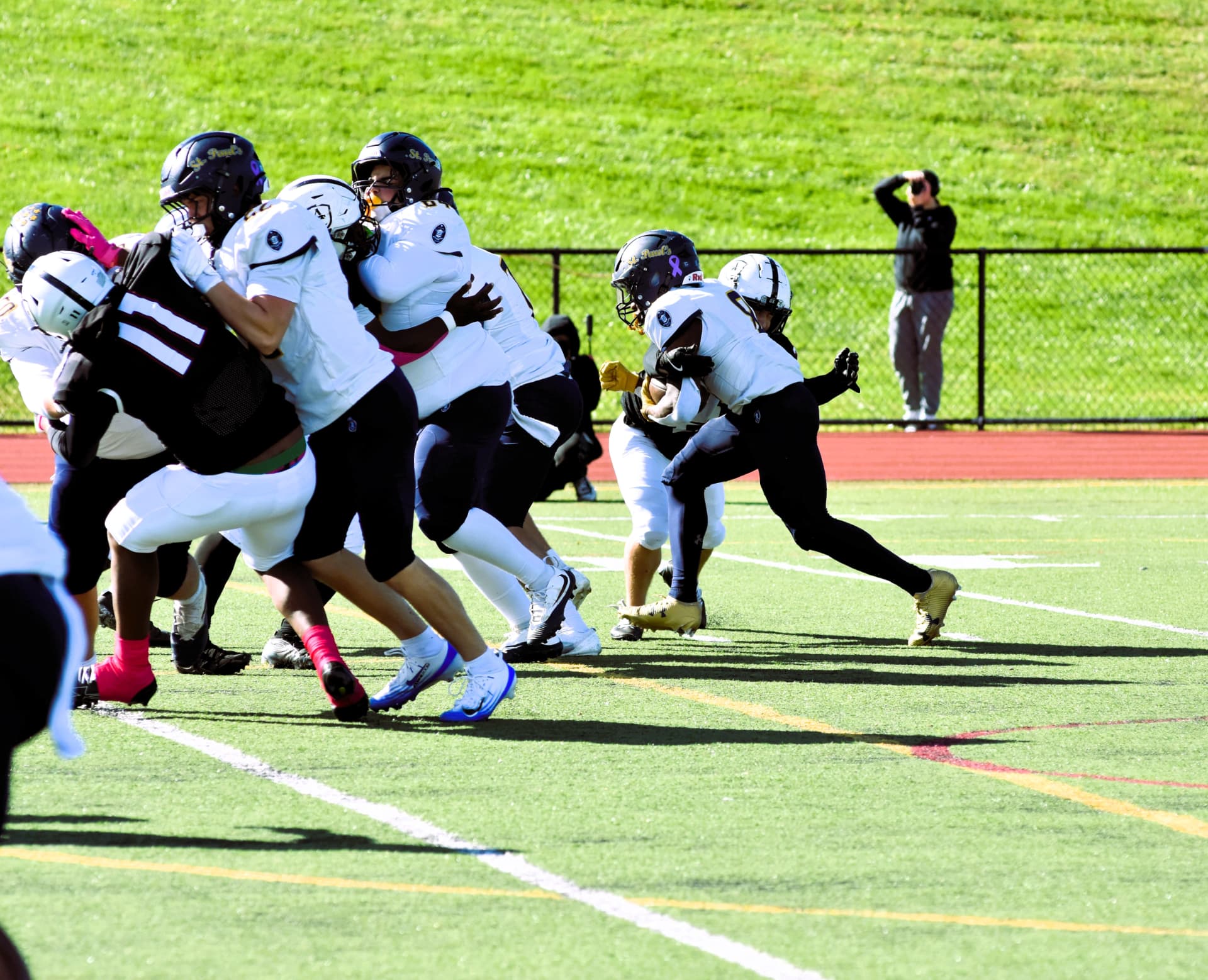 Crusaders block Curley defenders at the line of scrimmage