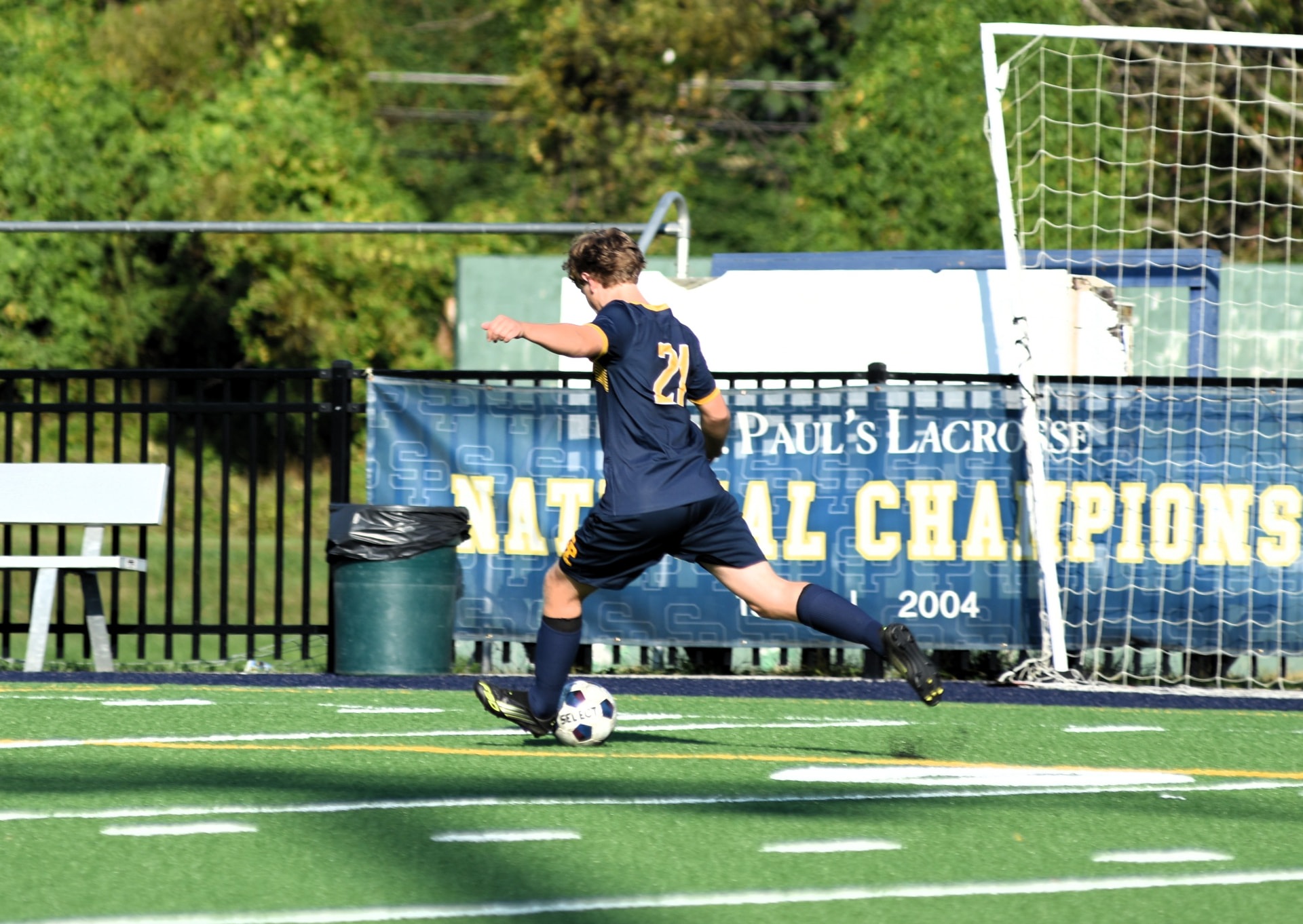 Crusaders number 21 winds up for a long ball