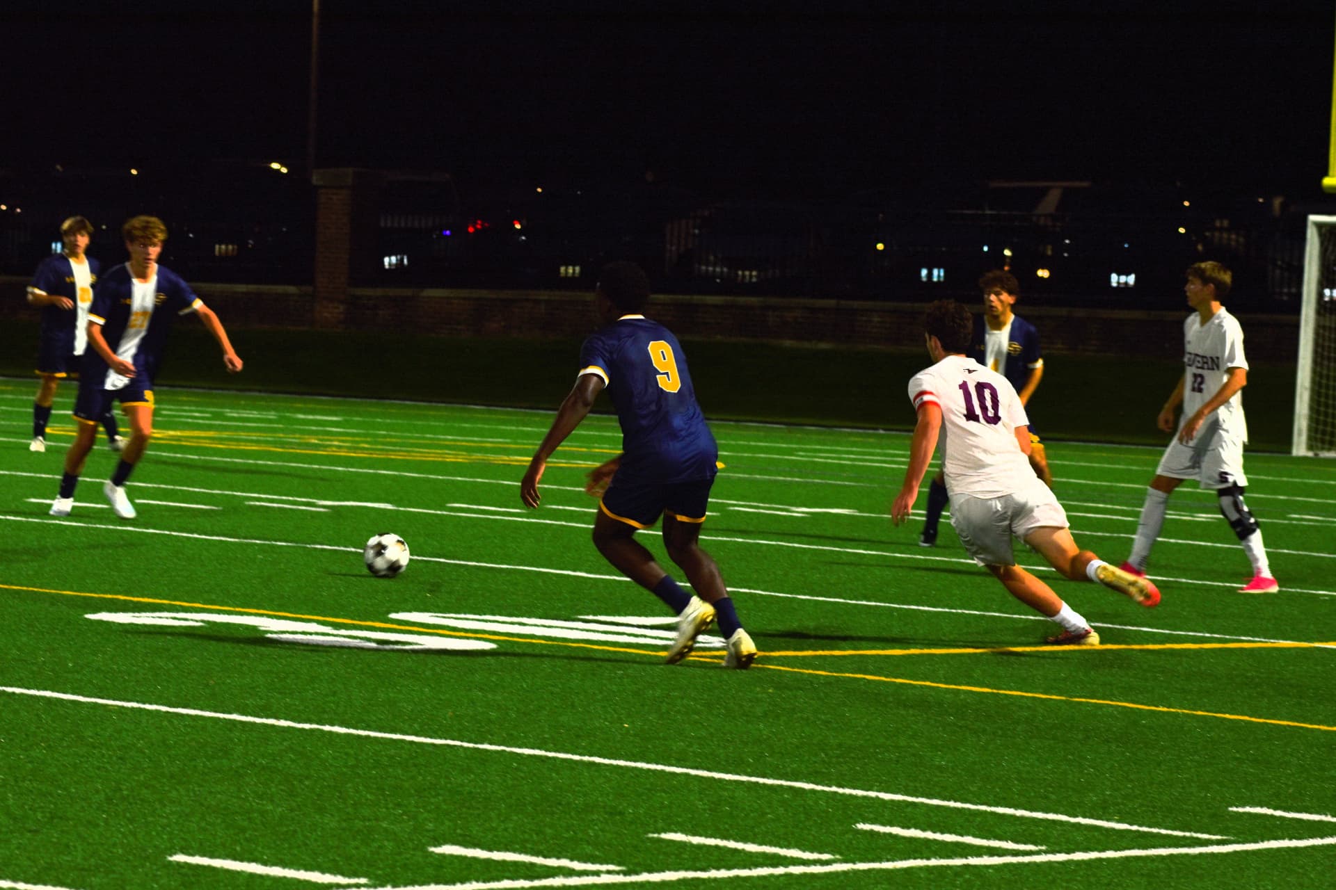 SP number 9 pursues the ball alongside Severn number 10
