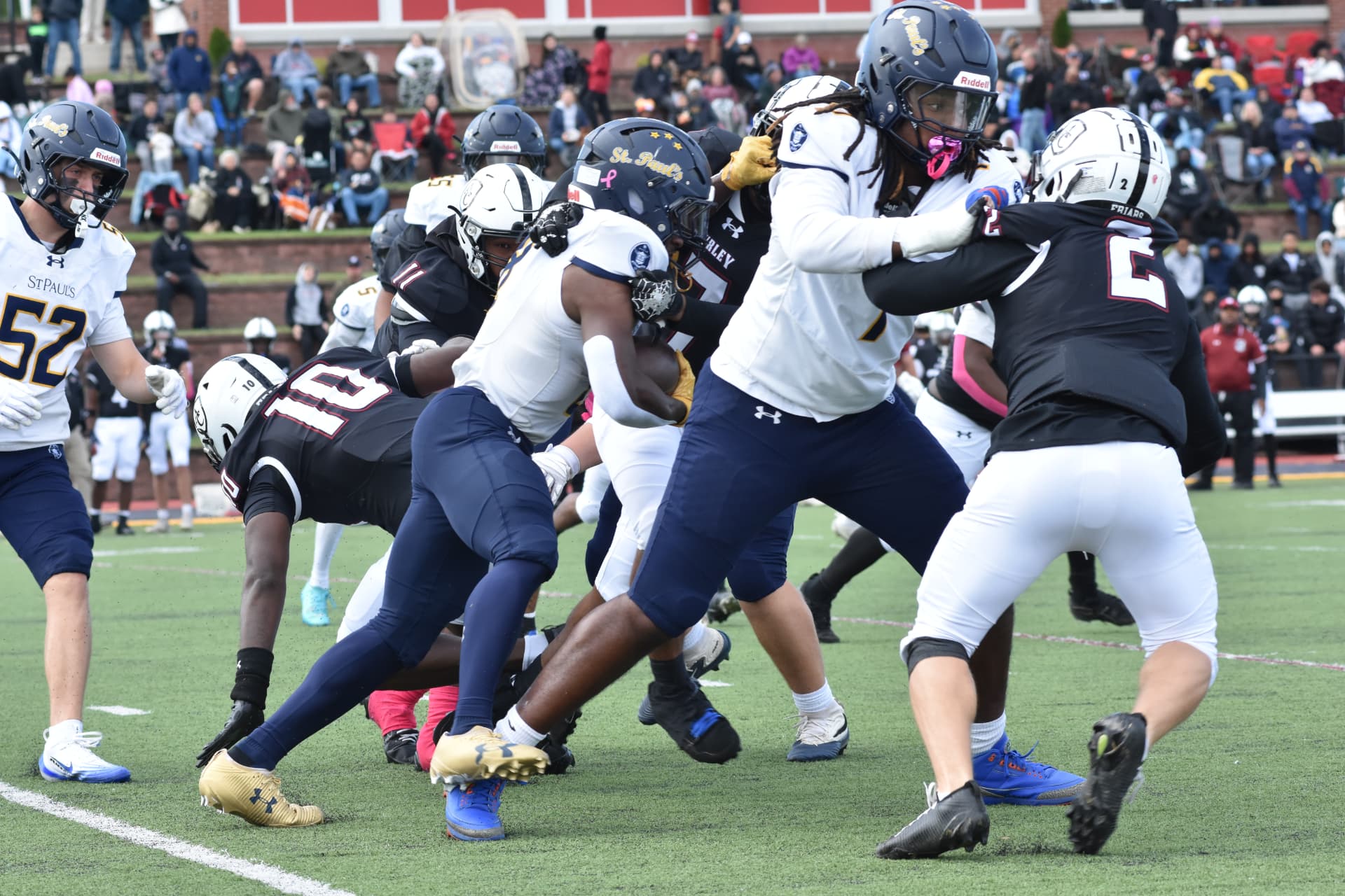 The Crusader line battles Curley's defense