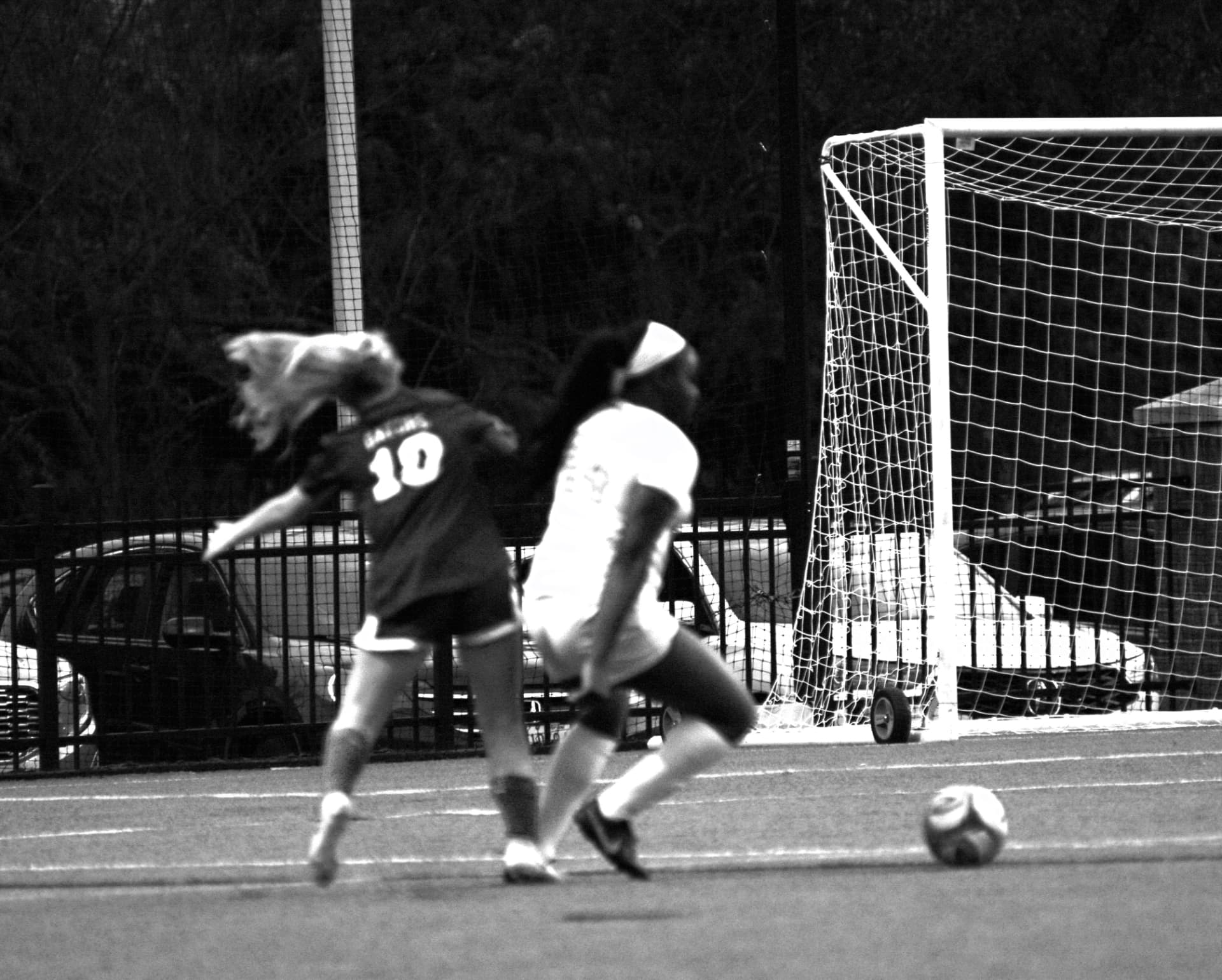 Gators number 10 battles a St. Timothy's defender near the goal