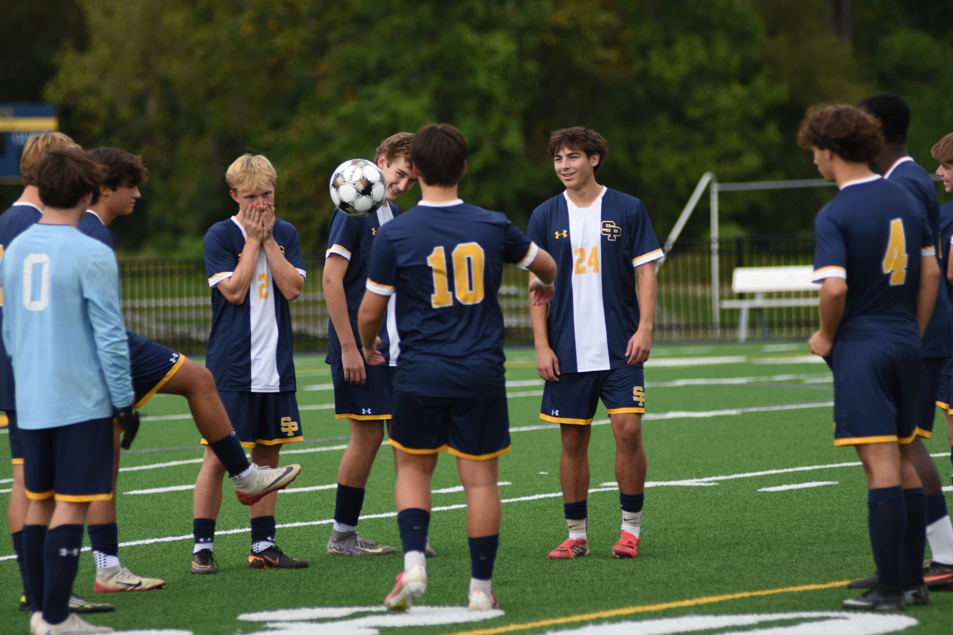 St. Paul's soccer players warm up with the ball