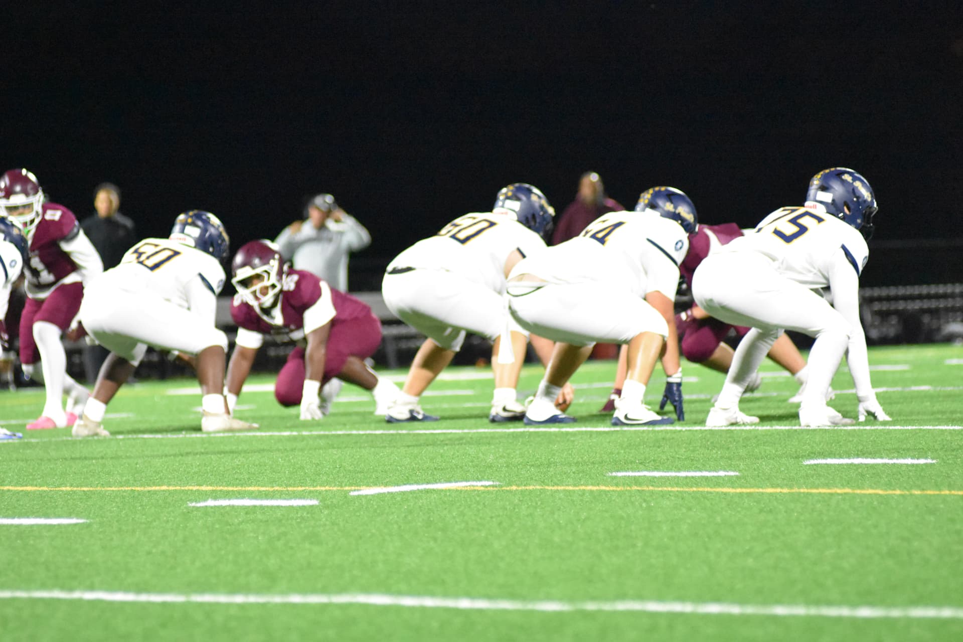 Crusaders offensive line in a three-point stance