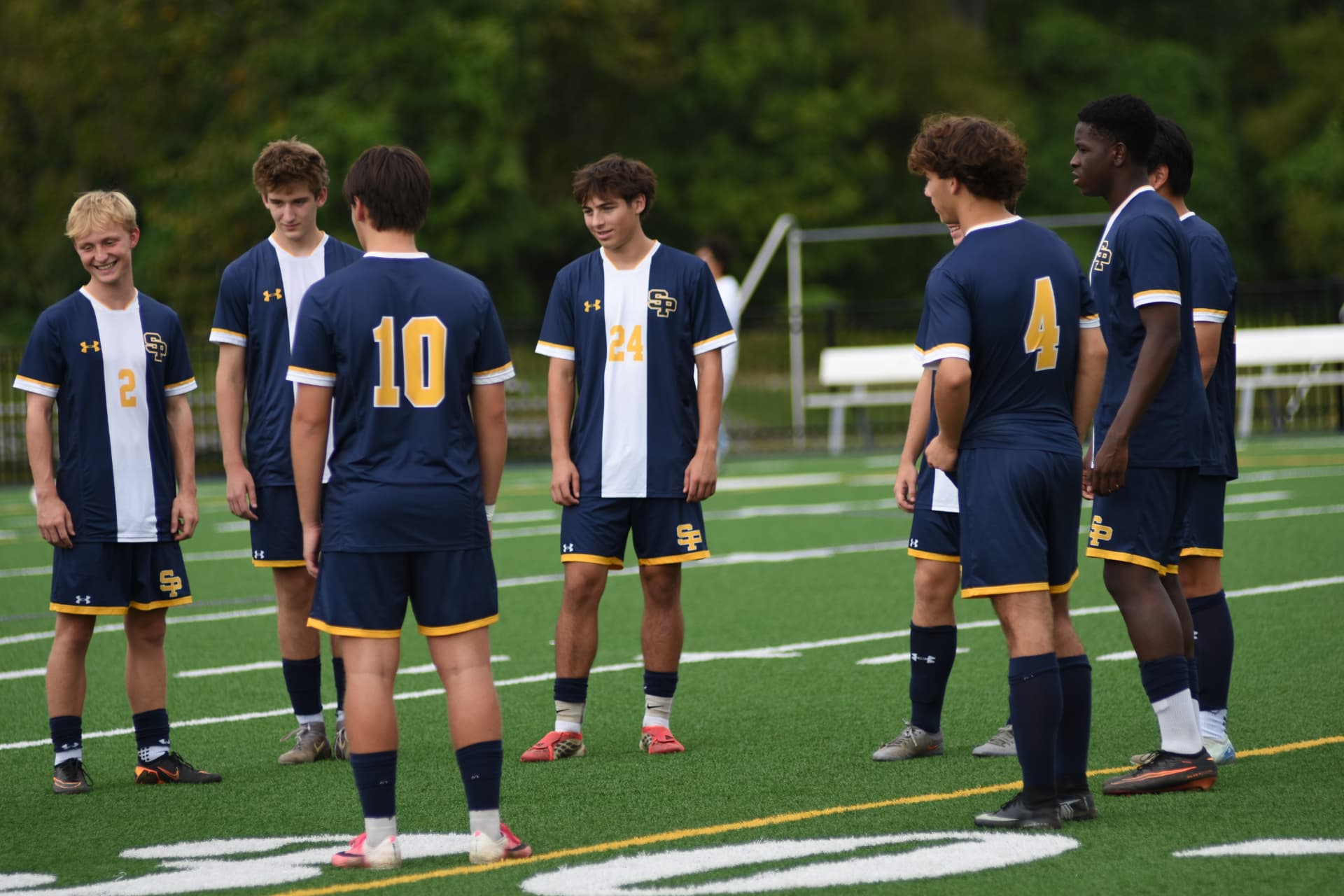 St. Paul's soccer players gather before play