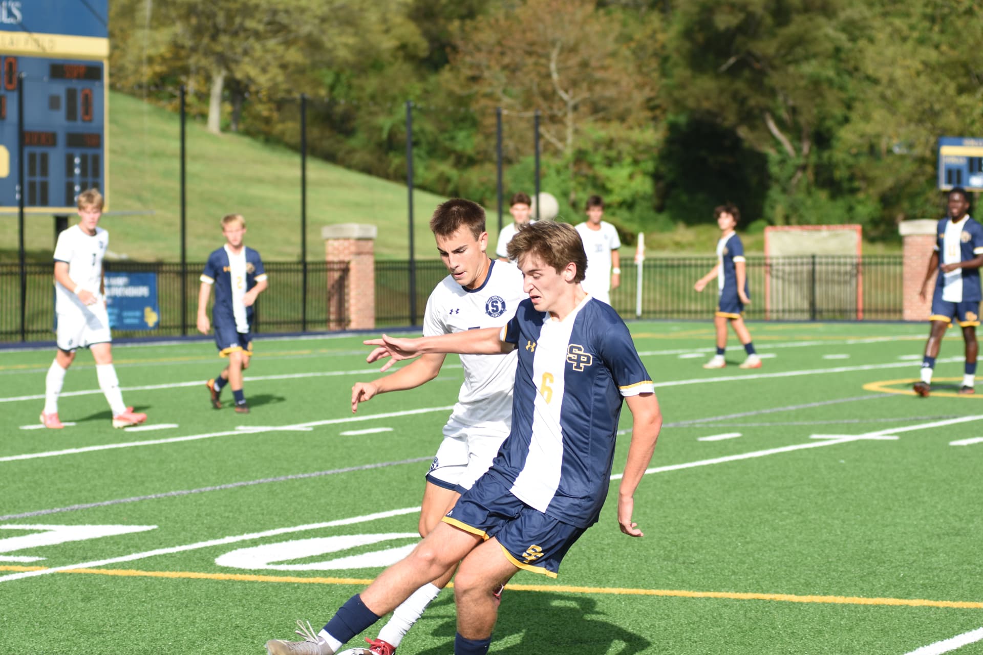 St. Paul's number 6 shields the ball from a defender