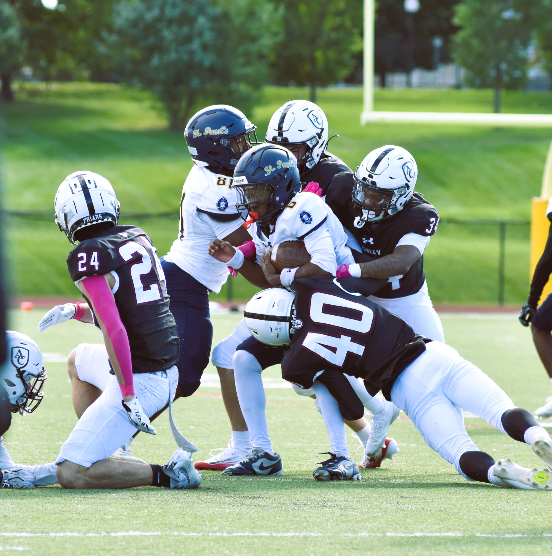 Curley defenders converge on the Crusaders ball carrier