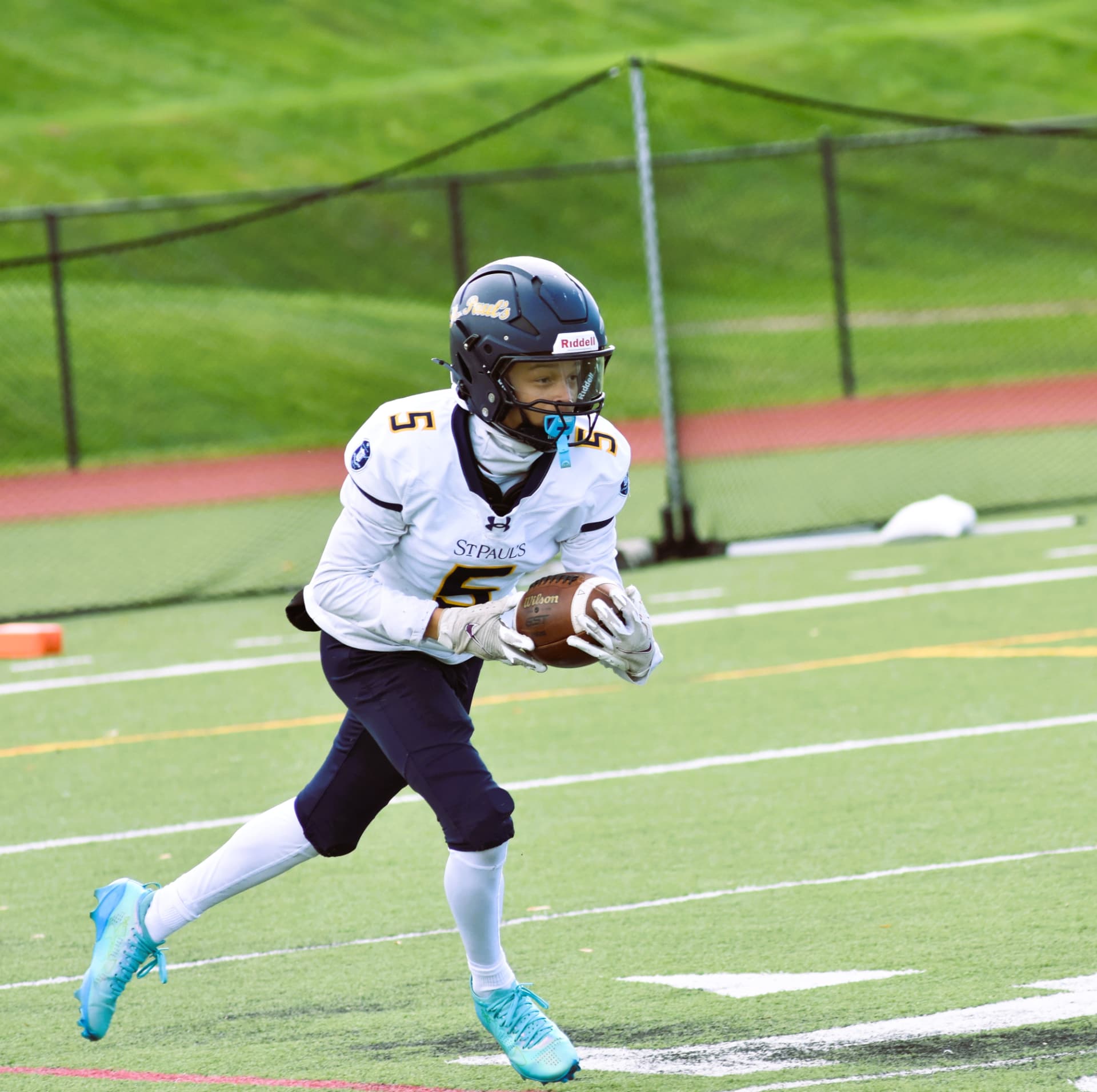 Crusaders number 5 hauls in a catch on the run