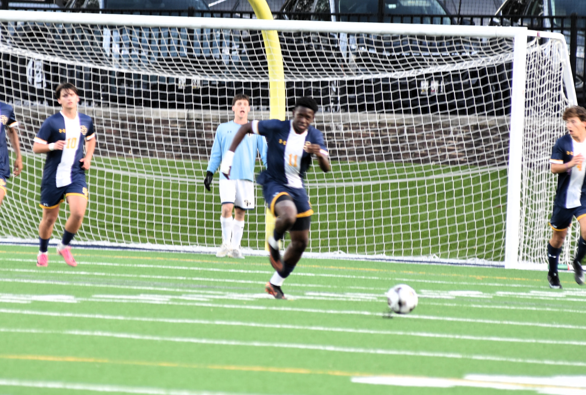 St. Paul's player advances the ball from the goal