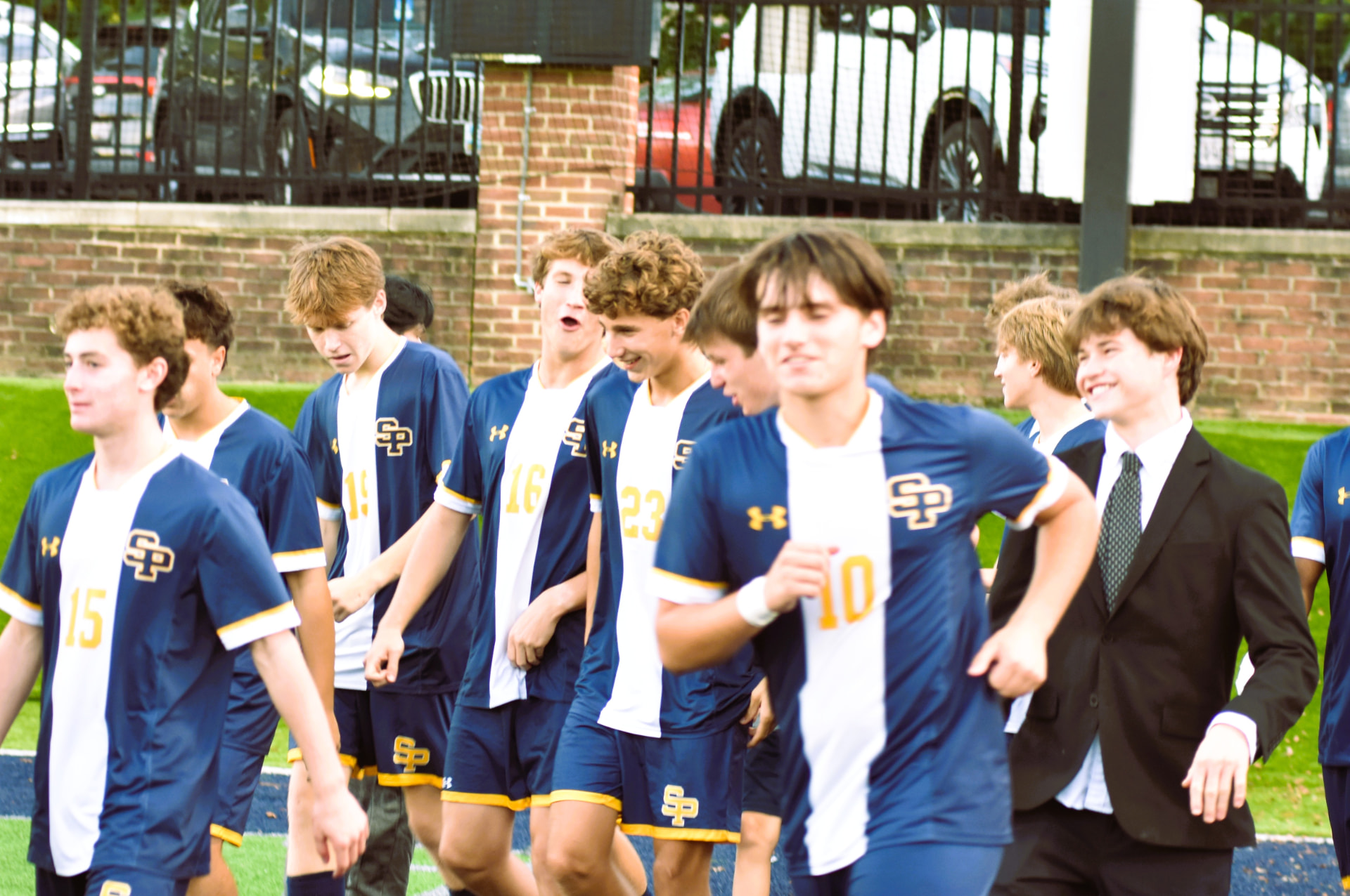 St. Paul’s players walk beside the field