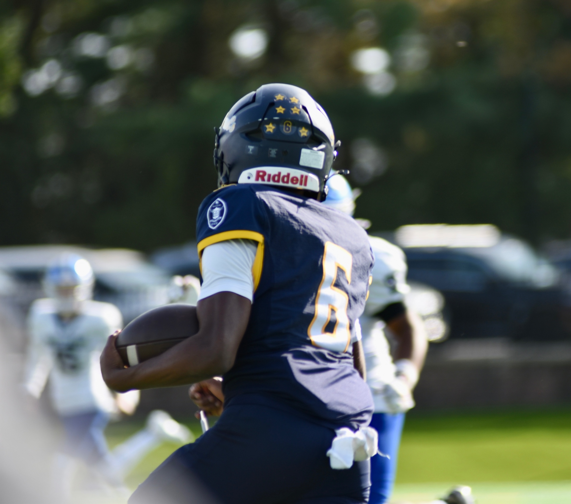 #6 carrying the ball upfield