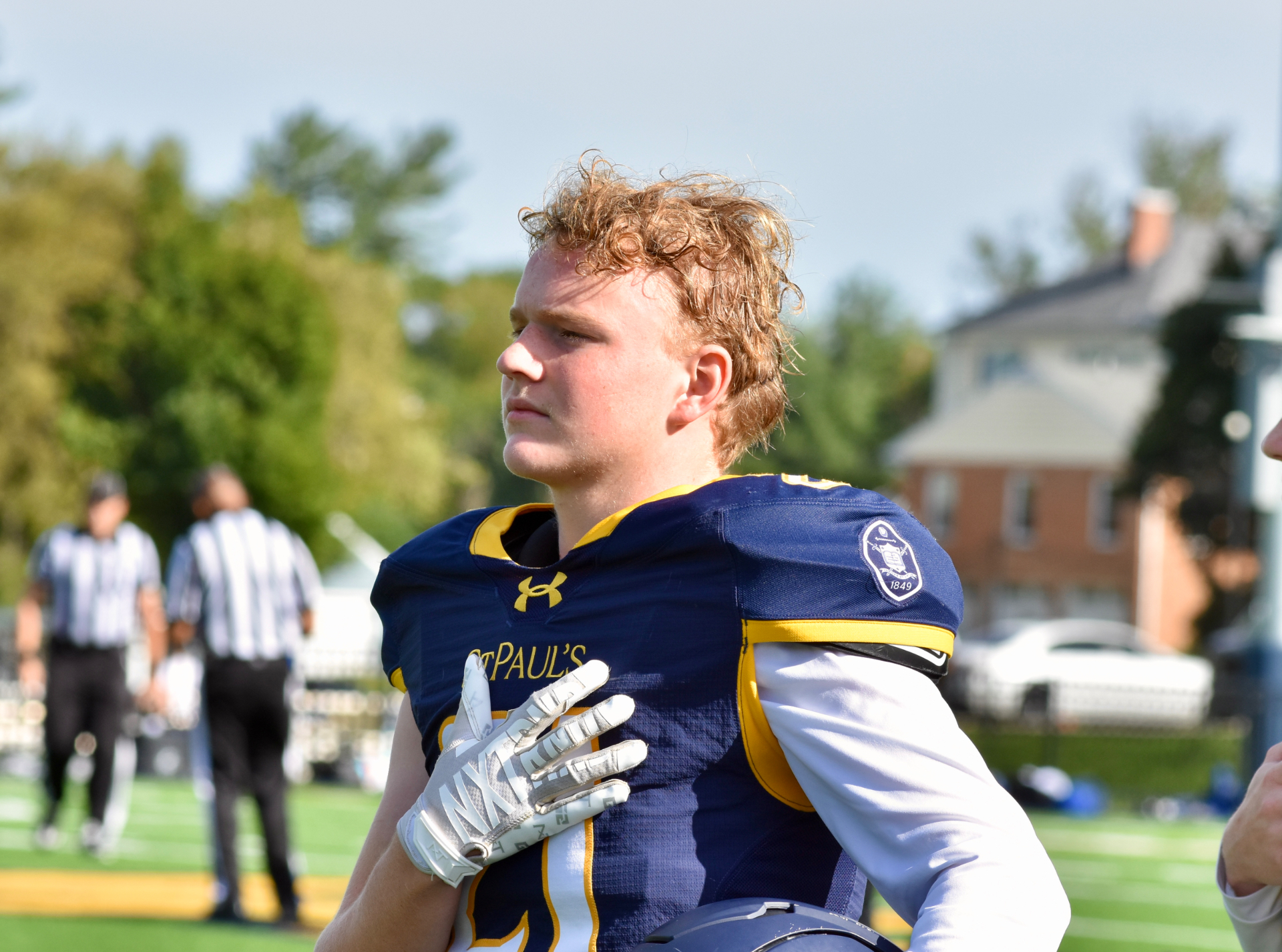 #21 holding his helmet after the game